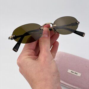 Miu Miu Women’s Oval Sunglasses – Old Gold Brown Model MUA54S 26C09Z AUTHENTIC